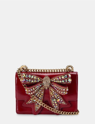 Patent shoulder bag with red bow