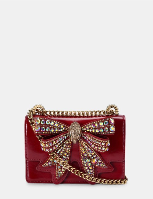 Patent shoulder bag with red bow