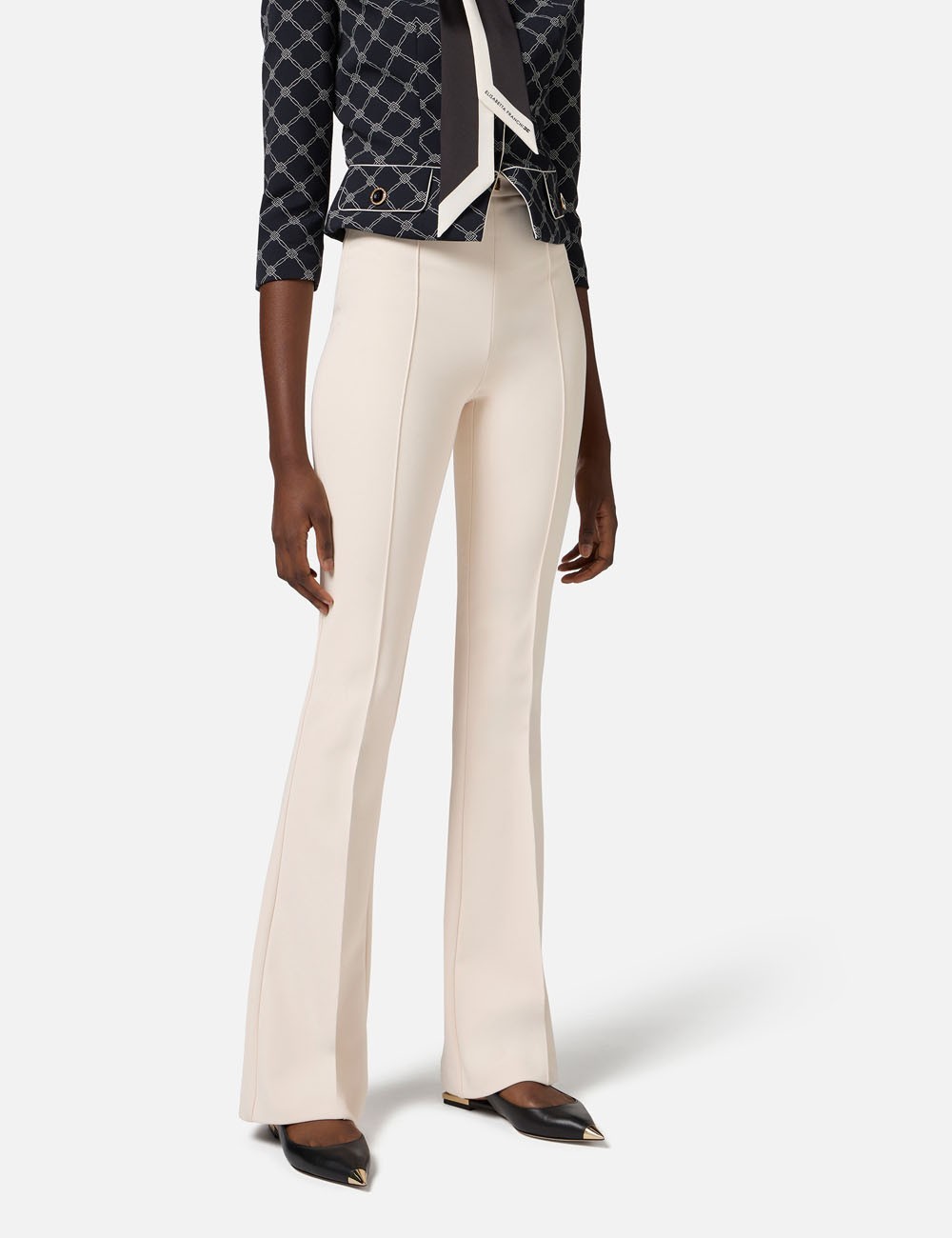 Crêpe bell-bottom trousers with logo plaque Butter