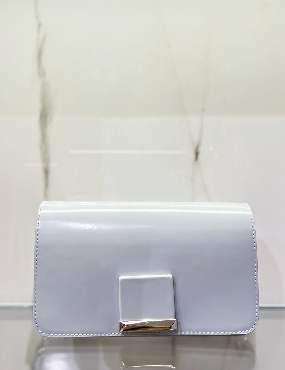 Tracolla in pelle RHODA con accessorio a contrasto ice