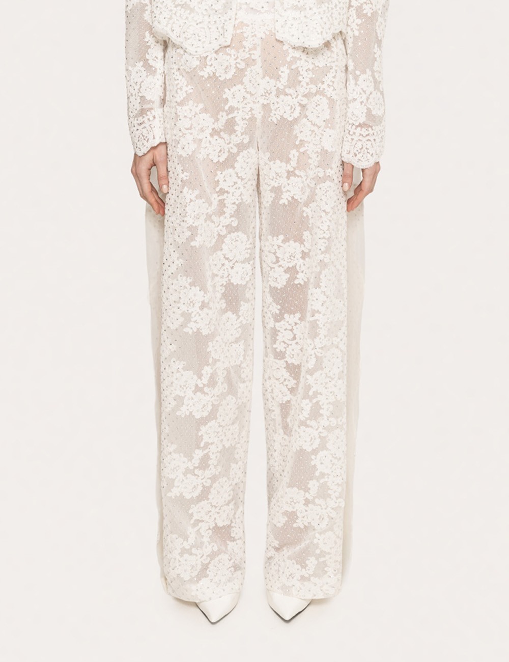 Pantaloni in pizzo decorato bianco