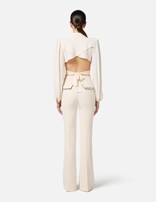 Pantaloni in crêpe con piping a contrasto burro nero