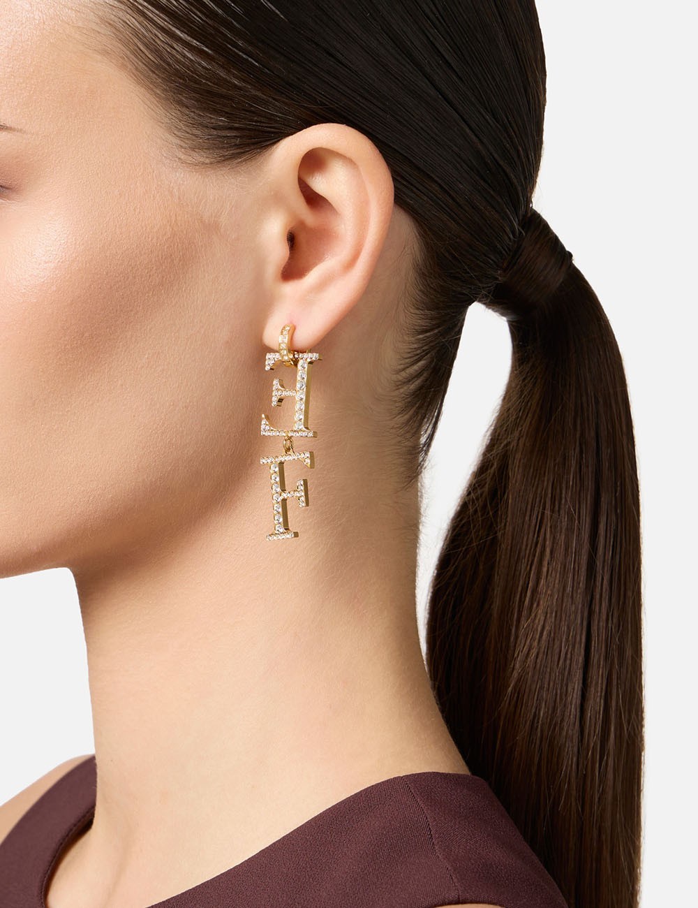 Orecchini in ottone con logo pendente oro giallo