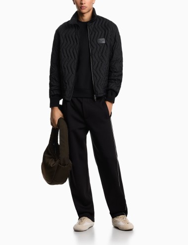 Pantaloni in double jersey con piping neri